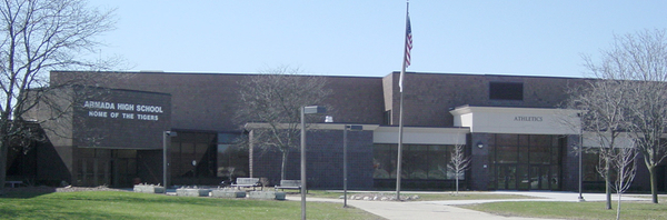 Image of the north side of Armada High School showing the main entrance and athletic entrance.