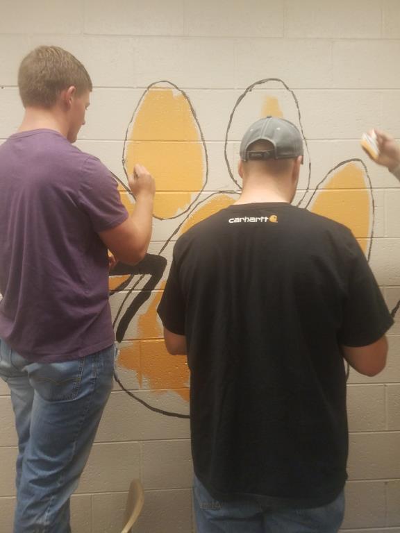 Mural in High School Kitchen being painted
